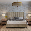 The Harper Bed featuring a wing design with large flutes and plush upholstery