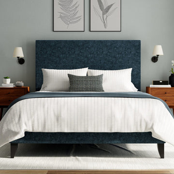 The Button Box Upholstered Bed with a luxurious button-tufted headboard and high-quality fabric upholstery