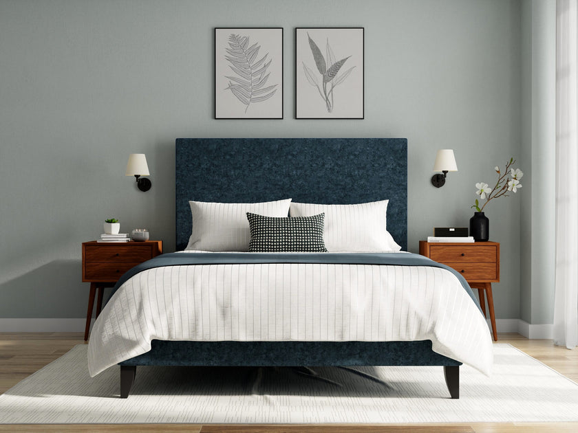 The Button Box Upholstered Bed with a luxurious button-tufted headboard and high-quality fabric upholstery