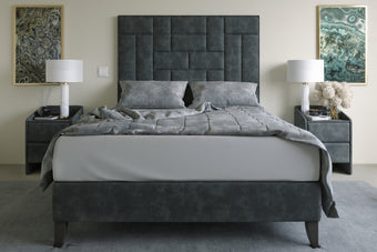 The Rowe Bed featuring cross panels of padded inserts and luxurious upholstery