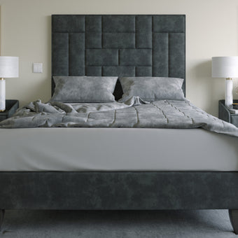 The Rowe Bed featuring cross panels of padded inserts and luxurious upholstery