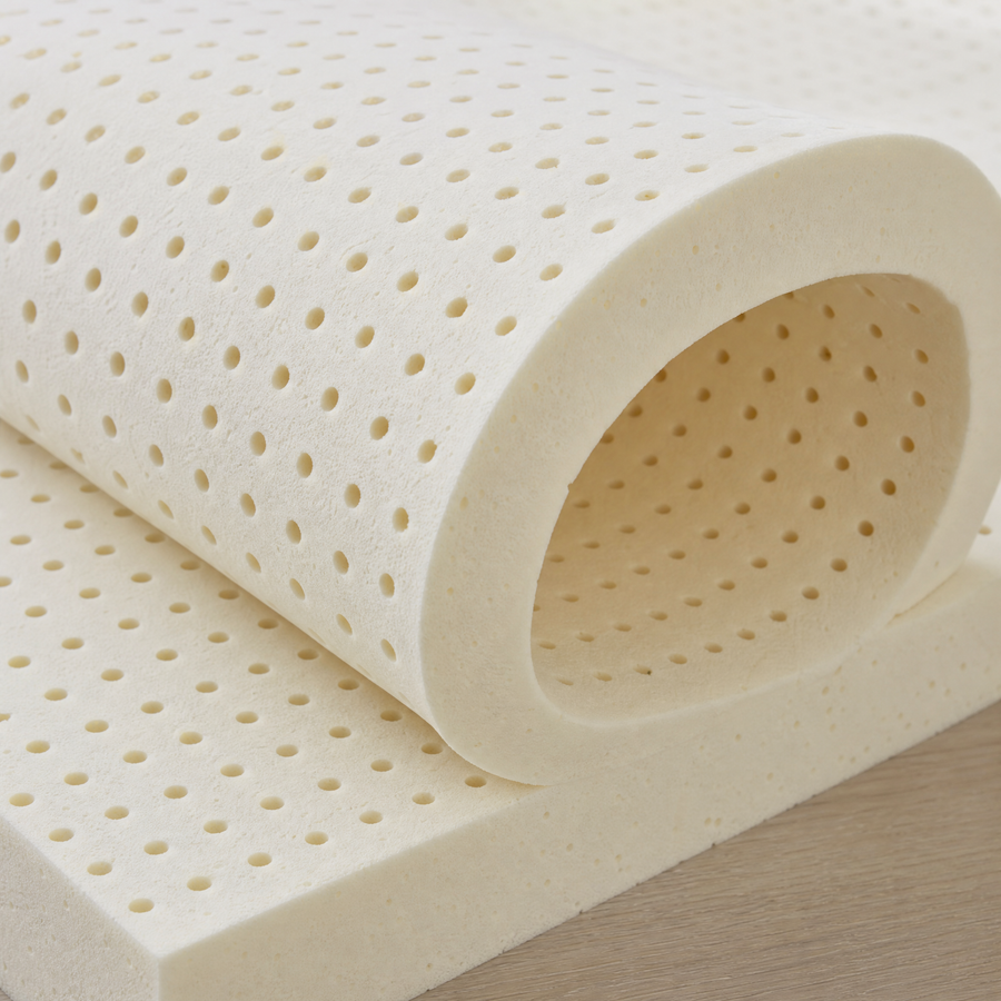A sheet of latex flexed by hand, showing its open pincore structure