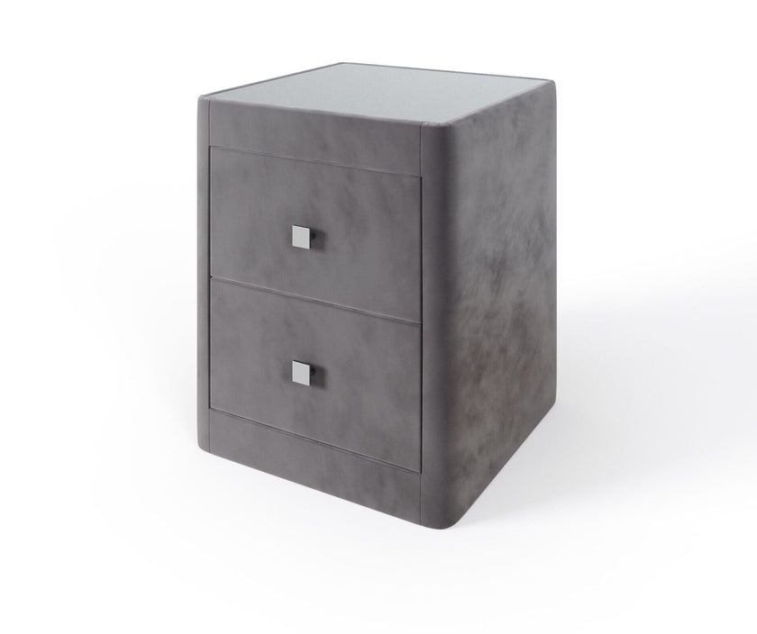 Luxurious upholstered bedside table with storage drawers