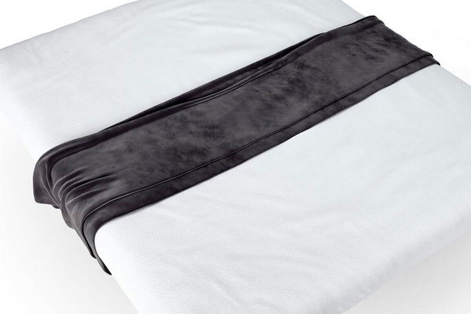 Elegant bed runner with stylish design on a neatly made bed