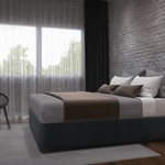 The Dartmouth Bed, a low-profile upholstered bed designed for use with a custom wall-placed headboard