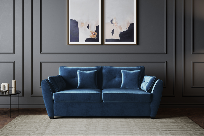 The Sofia Velvet Blue Sofa Bed featuring elegant upholstery and seamless conversion from sofa to bed