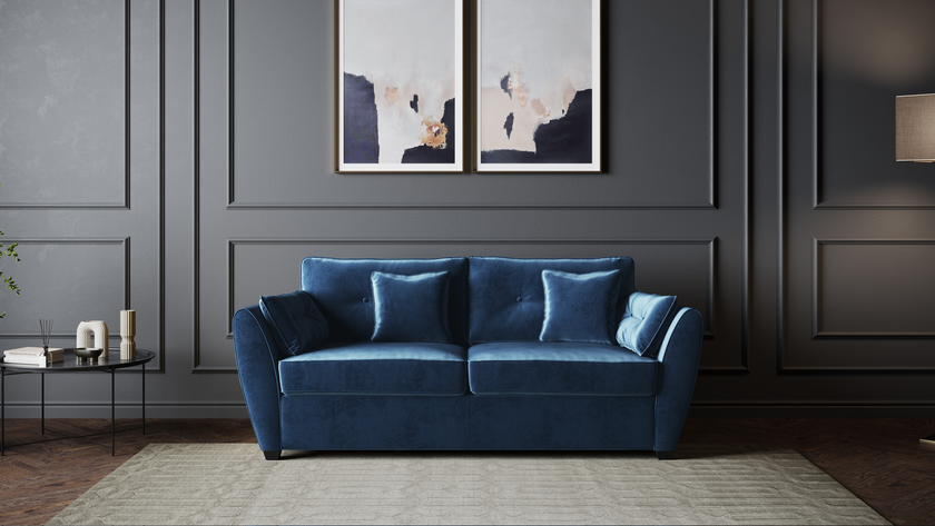 The Sofia Velvet Blue Sofa Bed featuring elegant upholstery and seamless conversion from sofa to bed