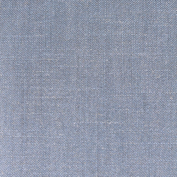 Soft blue Siena Sky fabric on upholstered bed