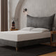 The Berkley Upholstered Bed resembling a large pillow with a French lunar seam, also available as a headboard-only option