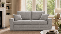 Rhea Sofa Bed in Light Grey in a living room
