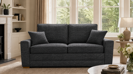 Rhea Sofa Bed in Dark Grey in a living room