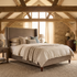 Ashbourne upholstered bed frame styled in an English barn interior