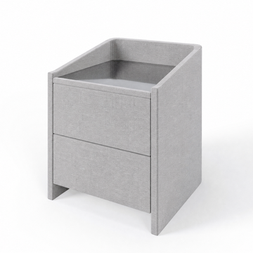 Lydie upholstered bedside table in Brugge Silver with glass top and two drawers