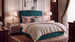 Dreamer manual ottoman storage bed in King 5'0, upholstered in Velvet Peacock teal velvet, base flush to the floor, alternate view